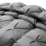 Transform your bedroom into a serene and tranquil oasis with our goose down comforter in a chic and versatile grey shade. This grey down comforter offers a cozy and stylish way to stay warm and comfortable all night long.