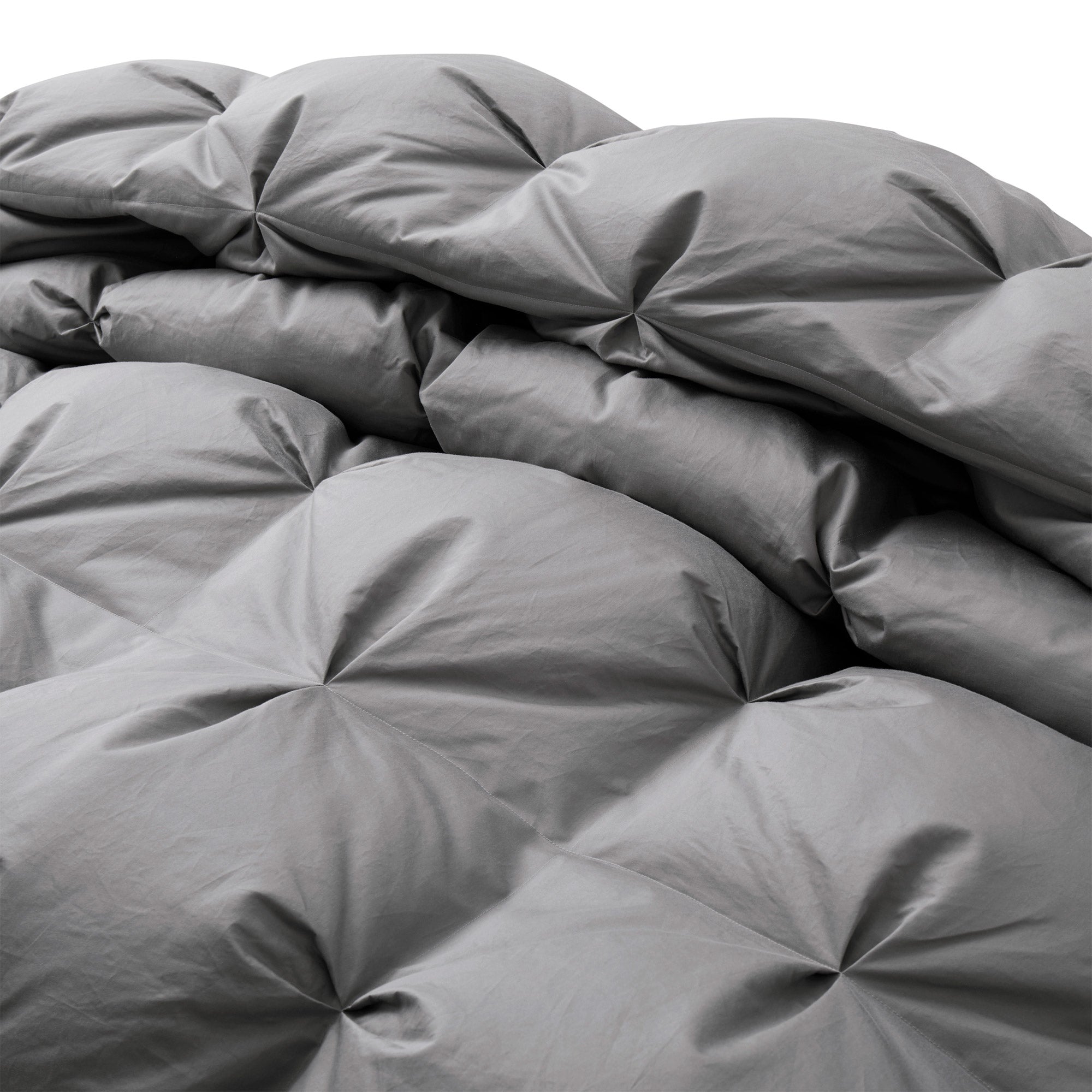 Transform your bedroom into a serene and tranquil oasis with our goose down comforter in a chic and versatile grey shade. This grey down comforter offers a cozy and stylish way to stay warm and comfortable all night long.