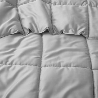 The comforter is brushed in somber hues of grey and infused with the floral aroma of camellia. Bring the freshness of flowers to your personal space with this comforter.
