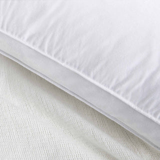 The white goose feather gusset pillows are covered in soft white hues. Welcome the perfect cradle of cloud-like comfort to your bedtime routine and improve your sleep quality with these feather goosedown pillows.