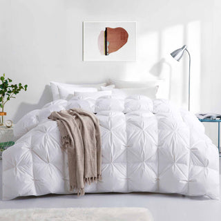 The winter down comforter is colored in crisp tones of white. Give your room a sense of space with this heavyweight down comforter.