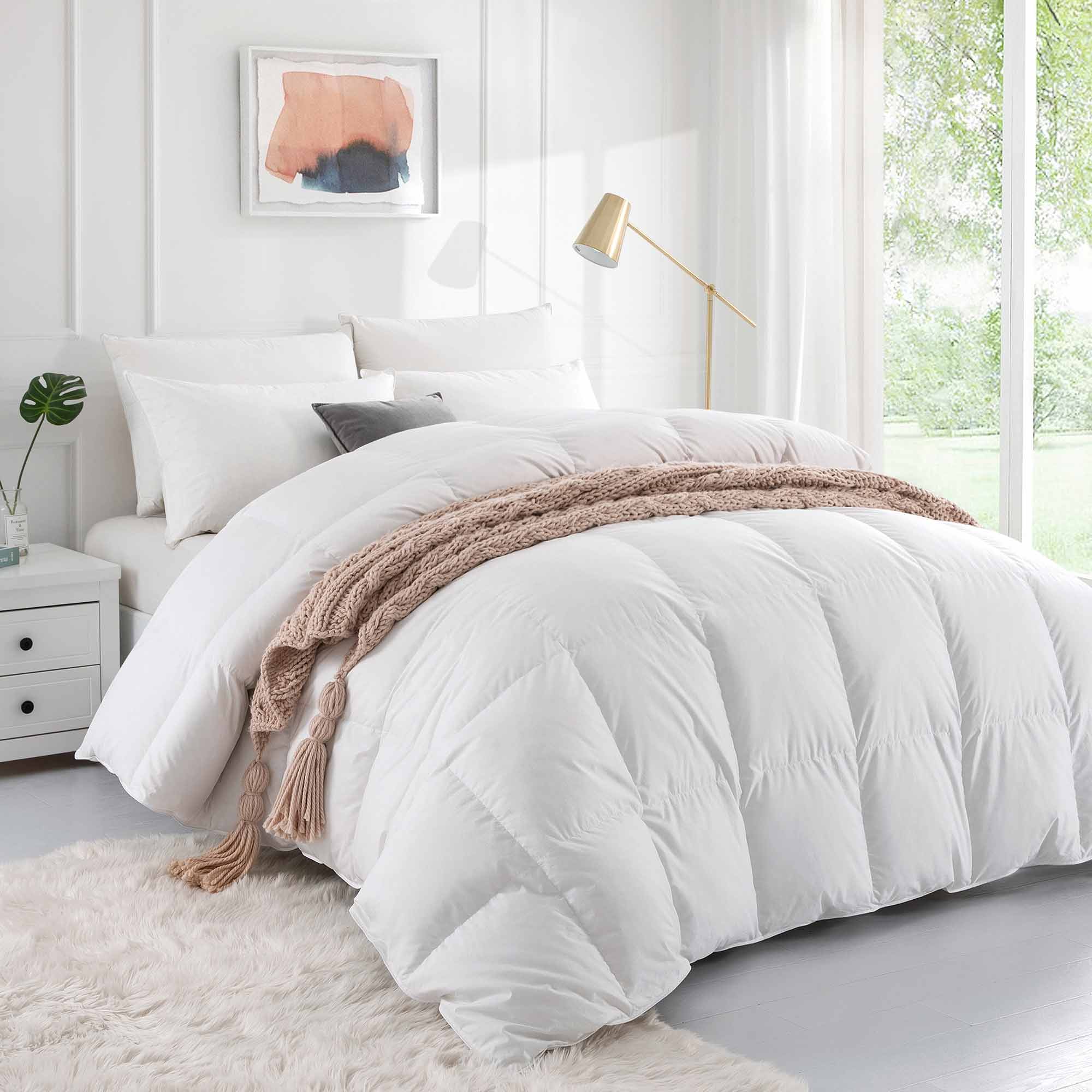 The goose down construction comforter set is colored in the immaculate tones of white. Bring an air of subtleness and minimalism to your bedroom with the Puredown white colored goose down comforter.