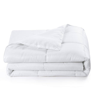 The all seasons down alternative comforter option is enveloped in the solid colors of white. Add a hint of stylish enamors to your modern bedroom design with this white alternative down comforter.